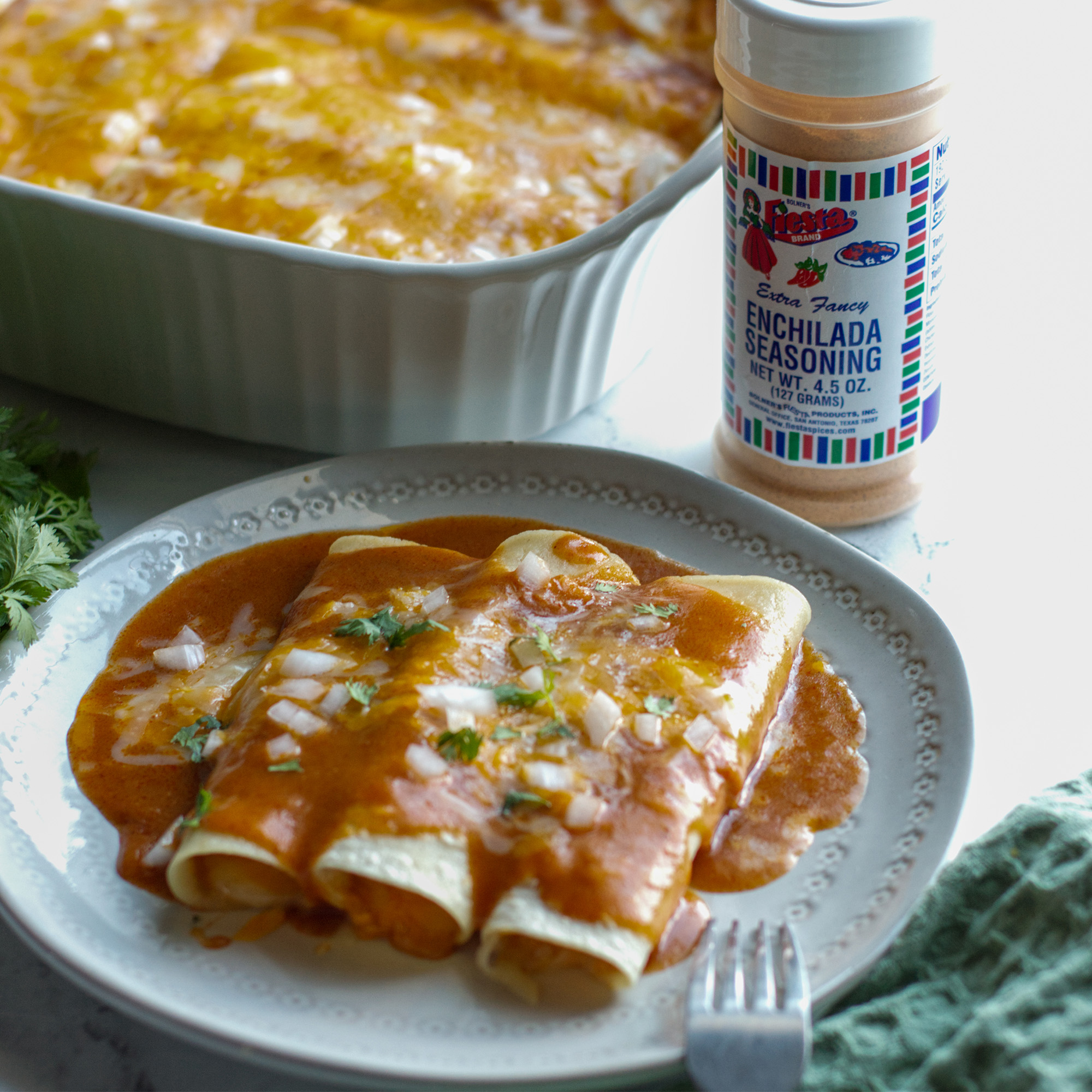 Plate showing three Enchiladas ready to serve