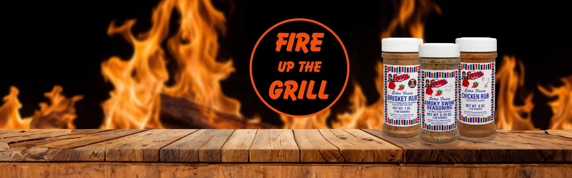 Fire up the grill wooden table with three jars of rubs with open flames in background